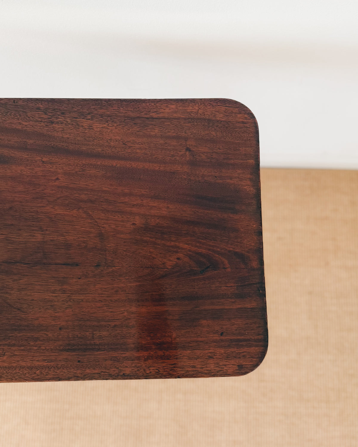 Figured mahogany top of an antique Sheraton tilt-top table dating to circa 1800
