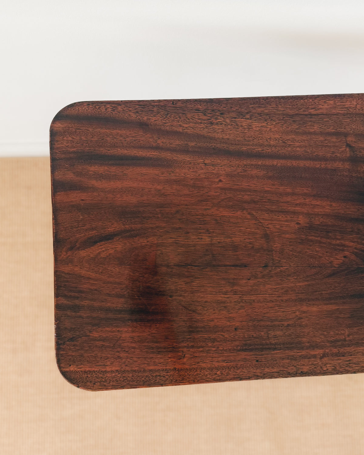 Figured mahogany top of an antique Sheraton tilt-top table dating to circa 1800