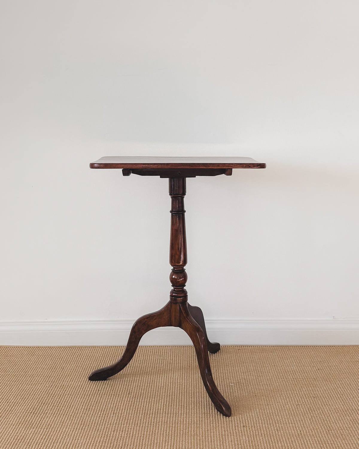 Antique Sheraton mahogany tilt-top table, circa 1800, with rectangular top and tripod pedestal base