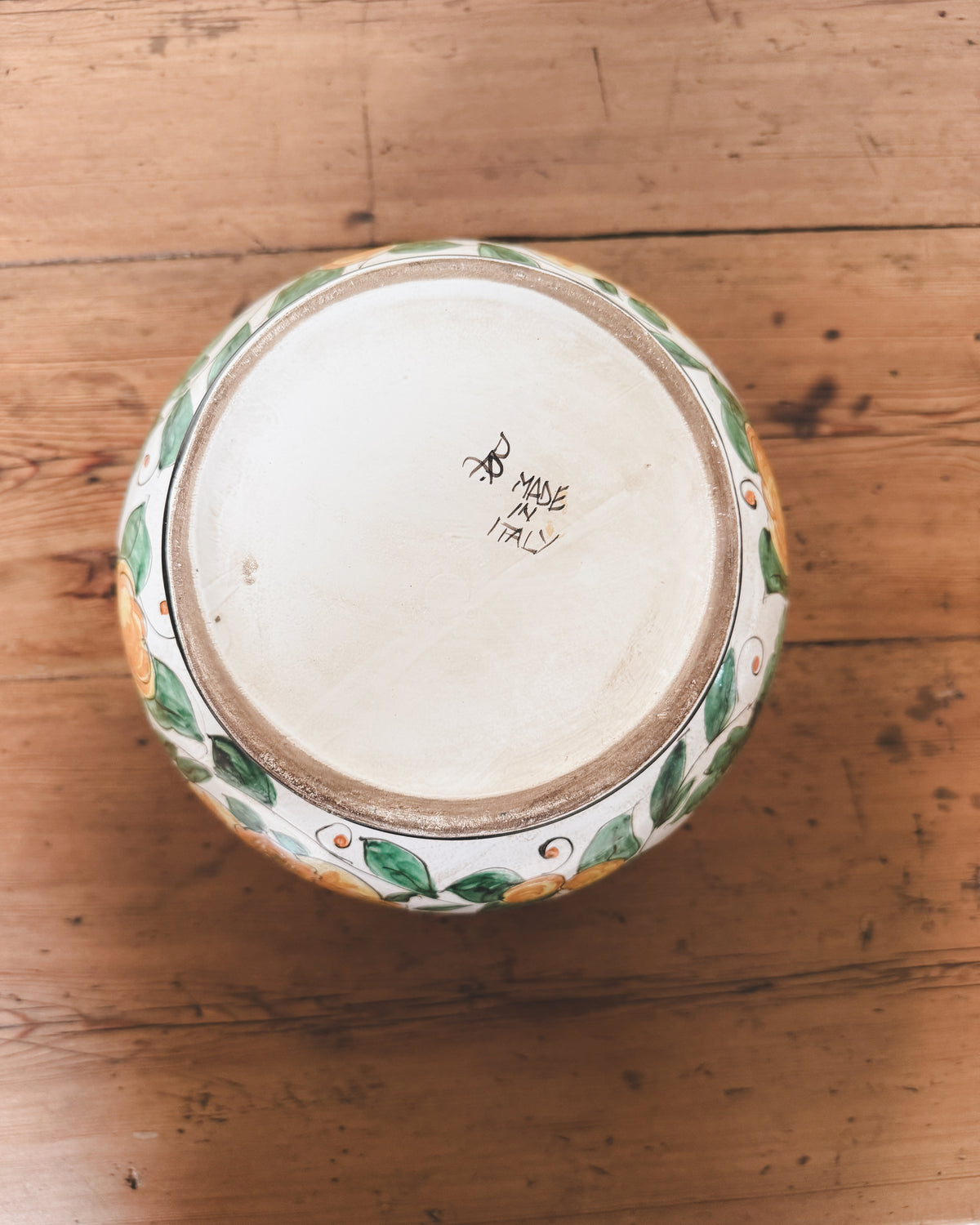 Base of vintage Italian ceramic jardiniere showing hand-painted Made in Italy mark.