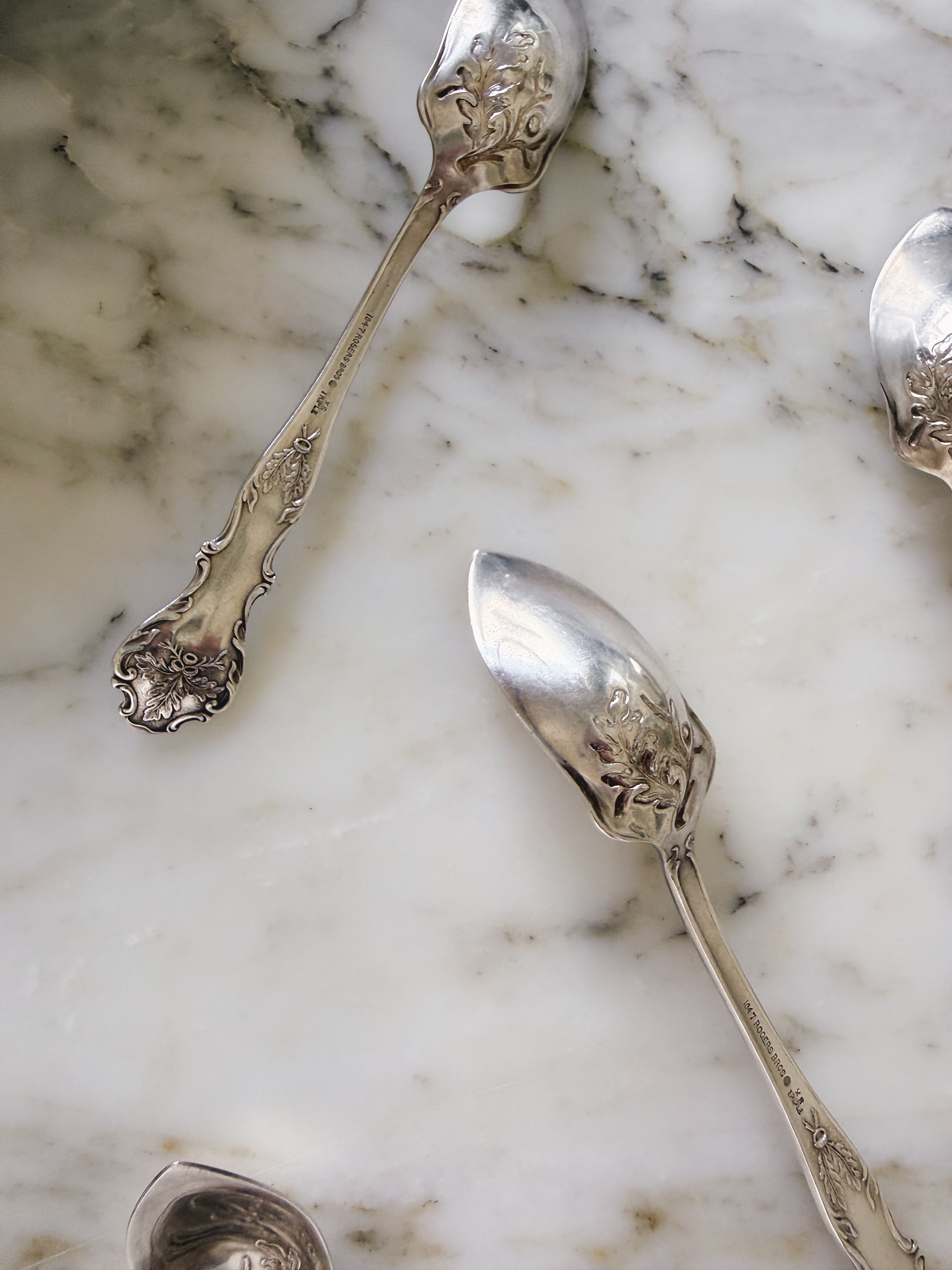 Antique silver grapefruit spoon set in oak pattern