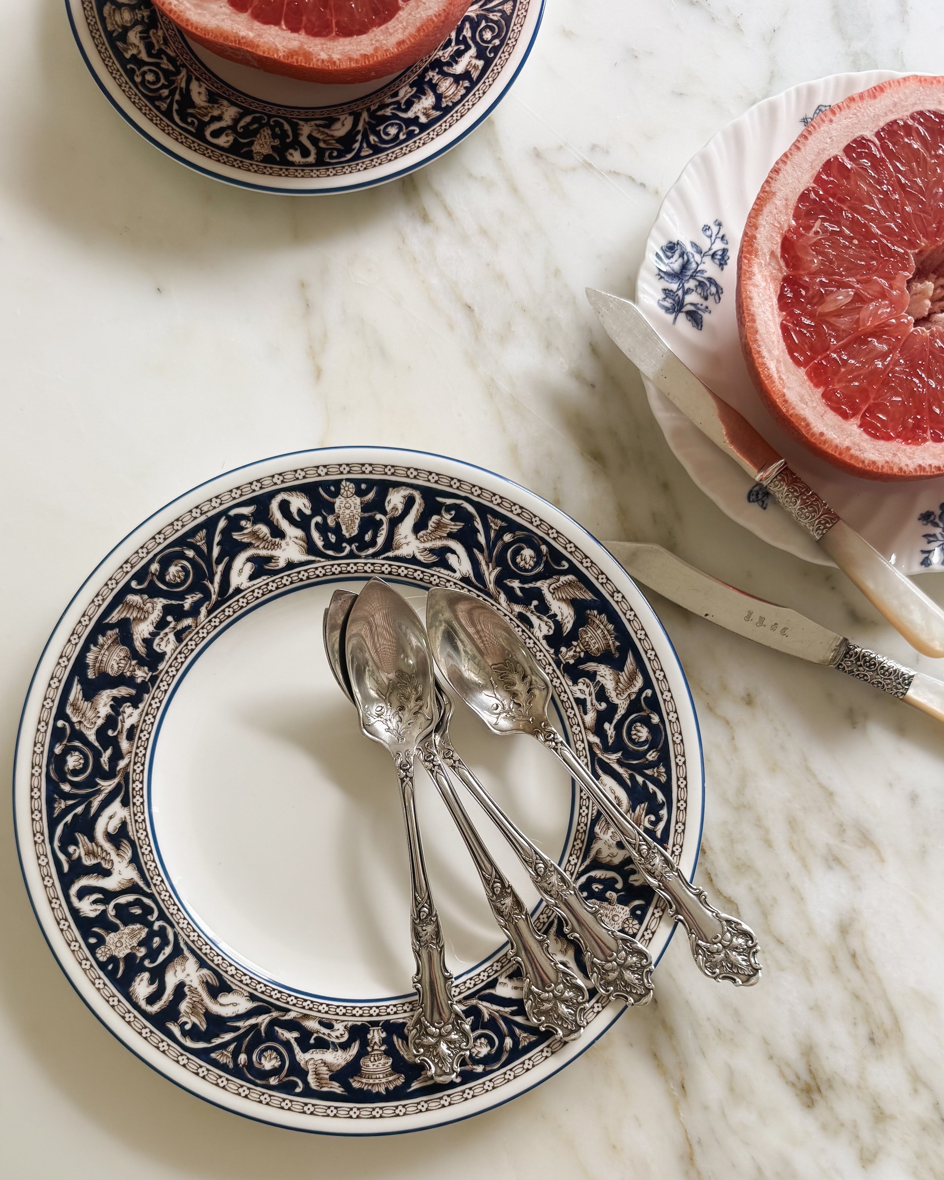Antique silver grapefruit spoon set in oak pattern