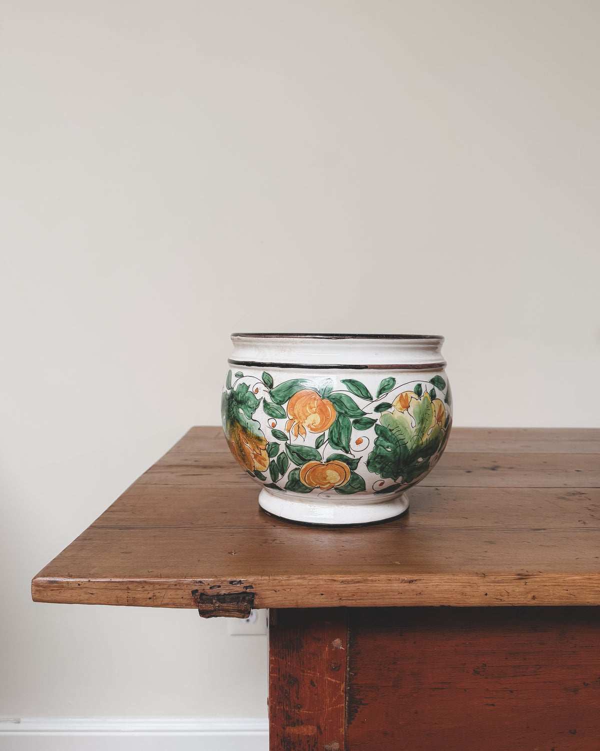 jardiniere.jpg	Vintage Italian hand-painted ceramic jardiniere with green and ochre botanical decoration.